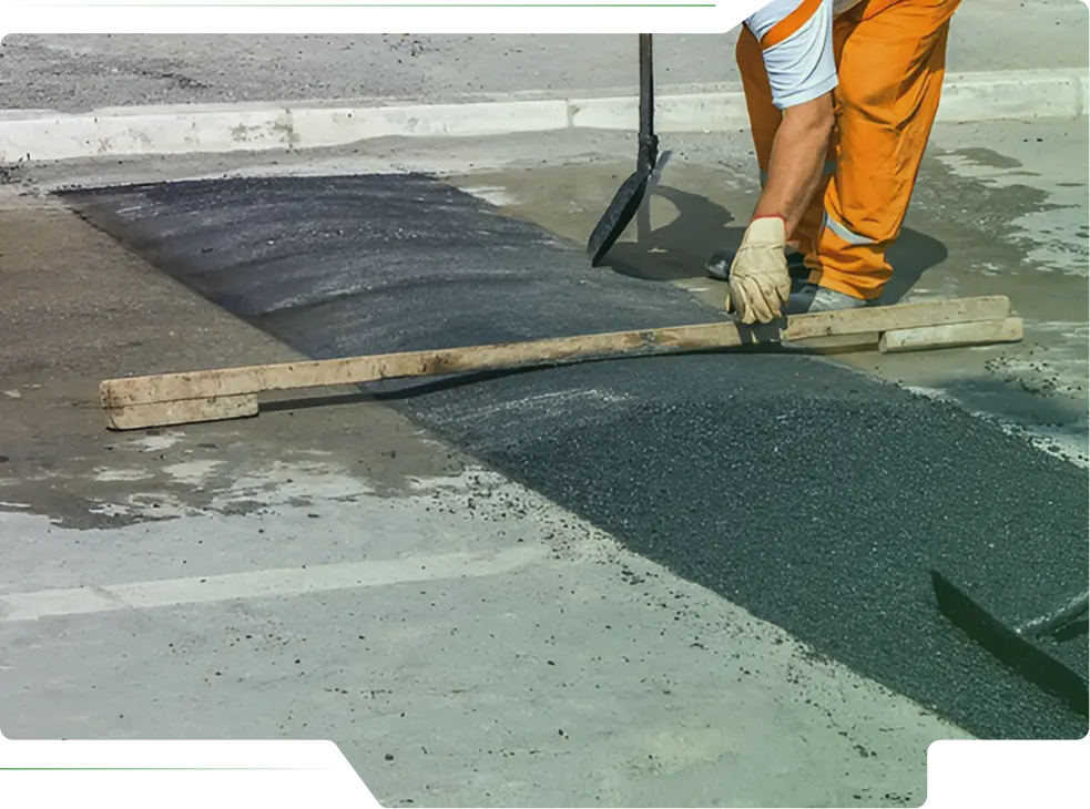 Worker laying pavement stones