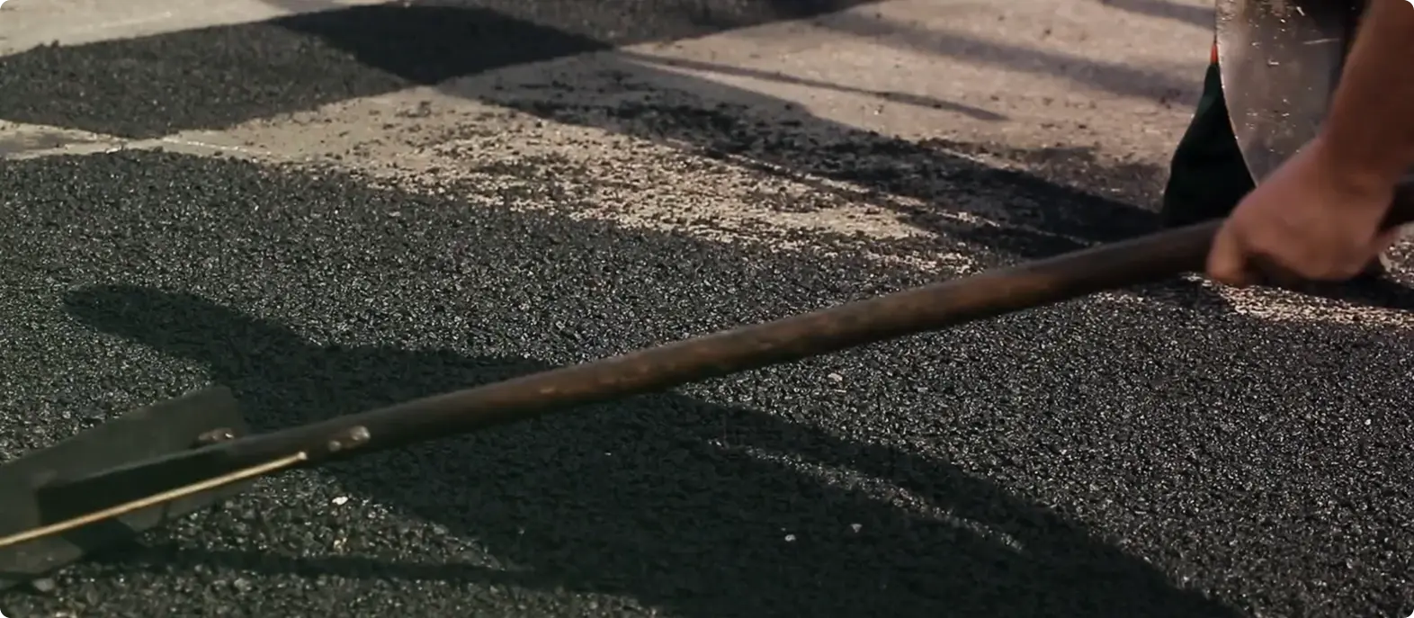 Worker laying pavement stones